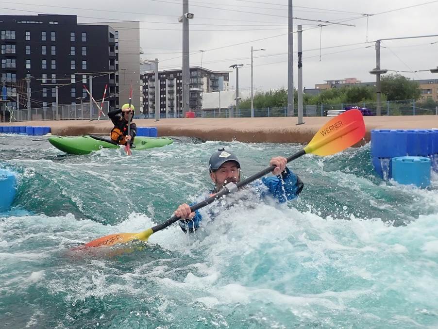 A group of people in kayaks in a river

Description automatically generated with low confidence