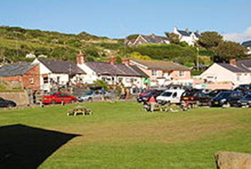 A picture containing grass, outdoor, sky, house

Description automatically generated