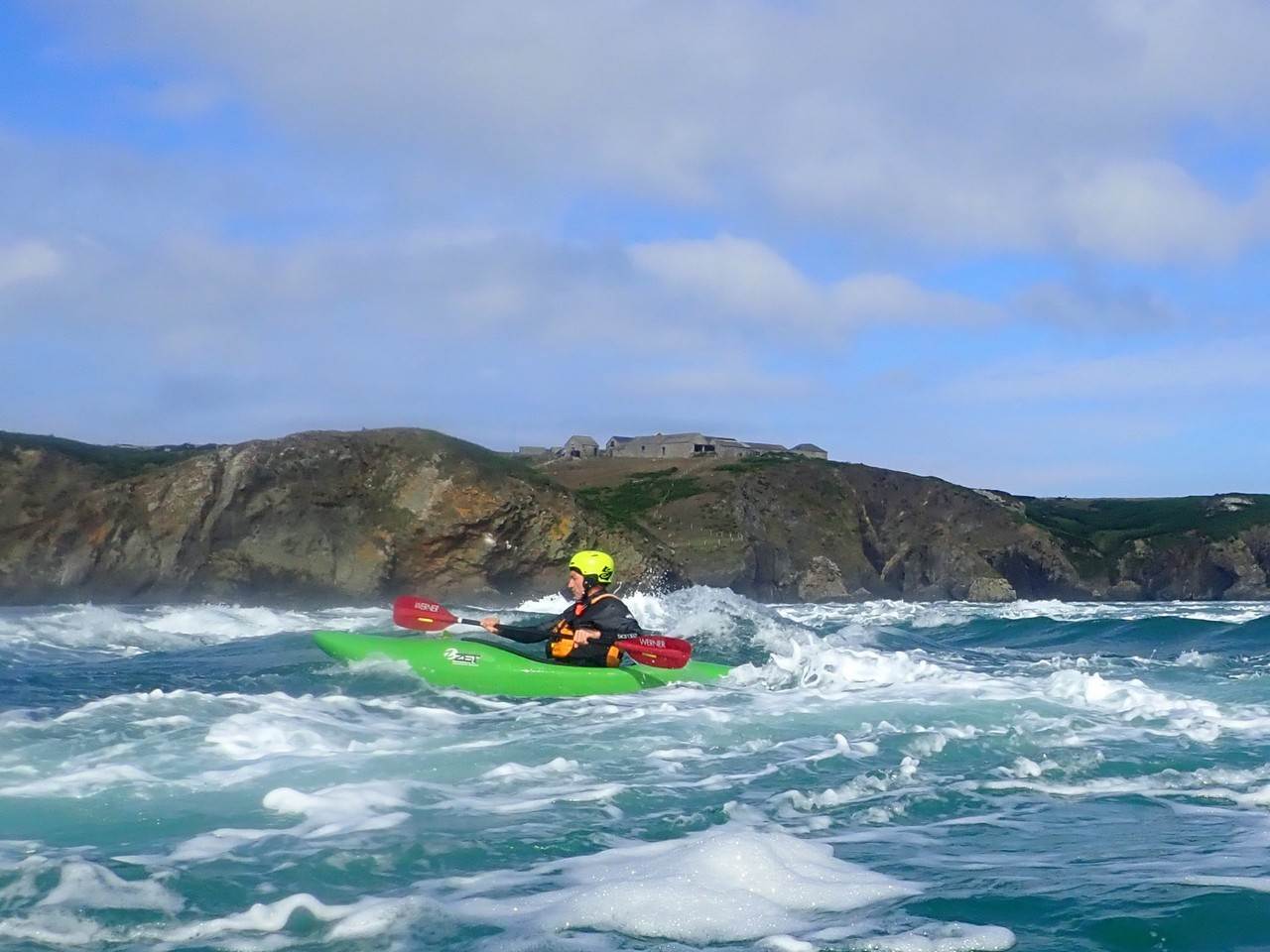 A person in a kayak in the water

Description automatically generated with low confidence