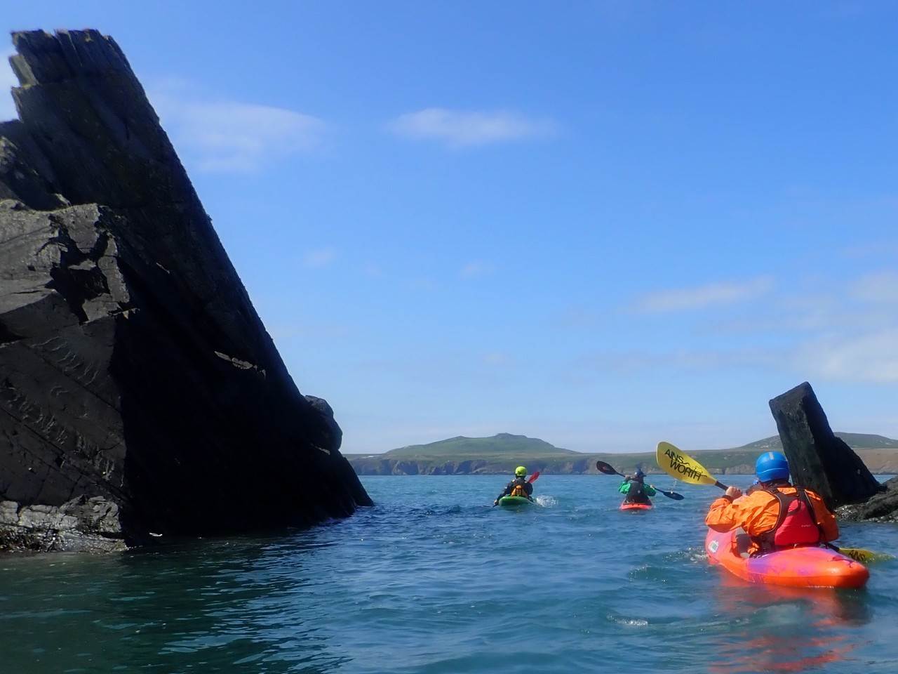A group of people in kayaks in a body of water

Description automatically generated with medium confidence