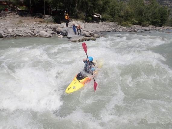 A person kayaking on a river

Description automatically generated with low confidence