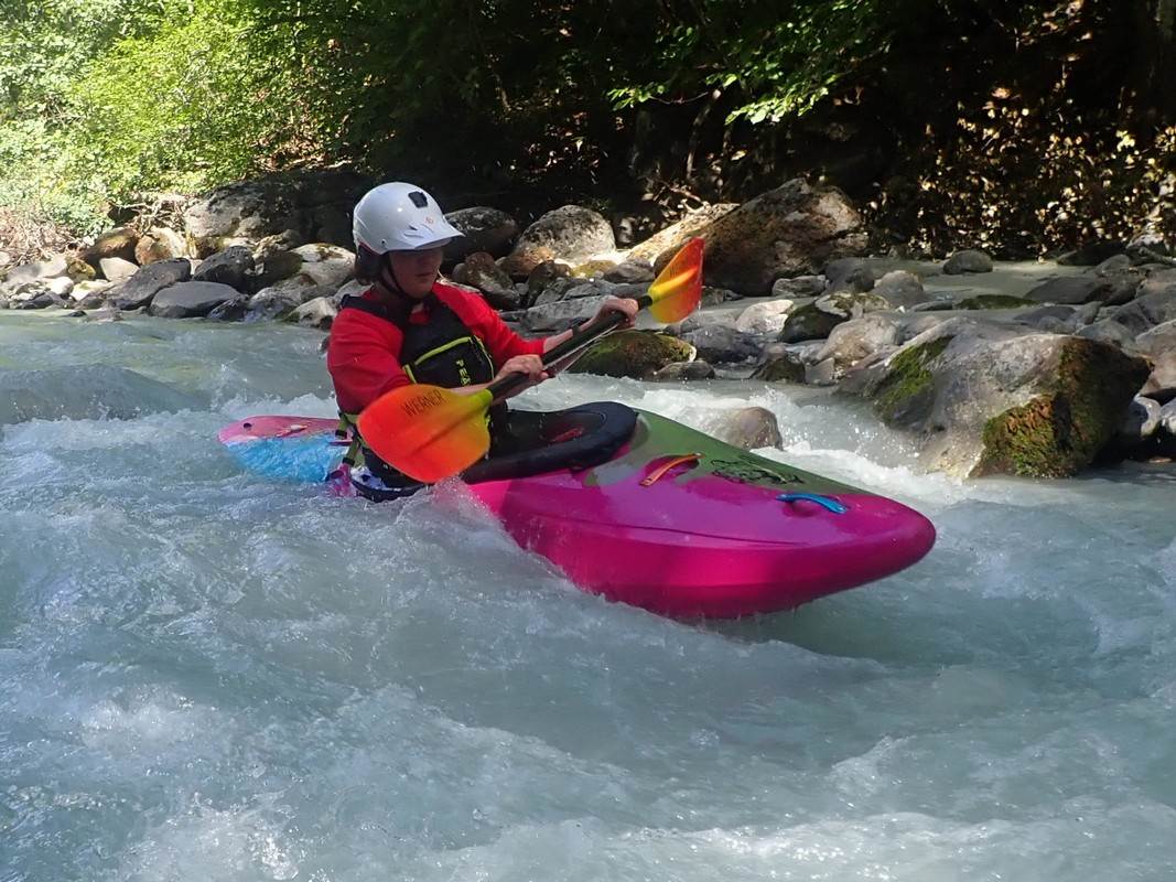 A person in a kayak in a river

Description automatically generated with medium confidence