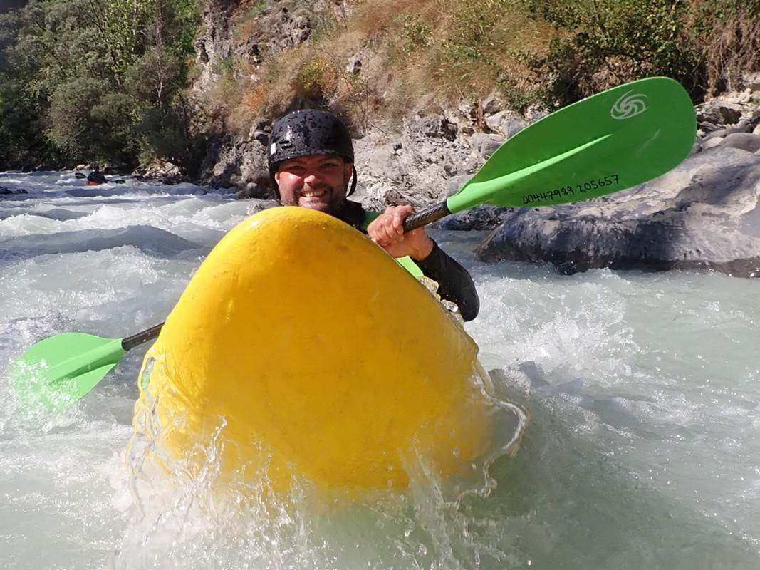 A person kayaking in a river

Description automatically generated with medium confidence