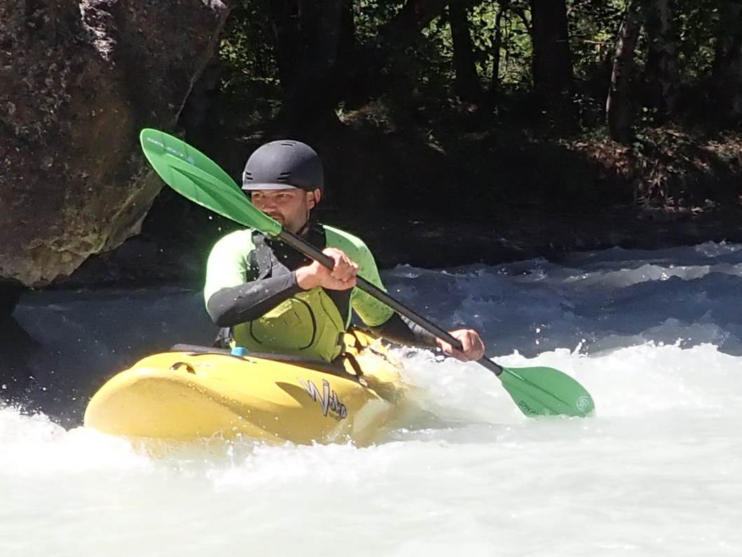A person in a kayak in a river

Description automatically generated with low confidence