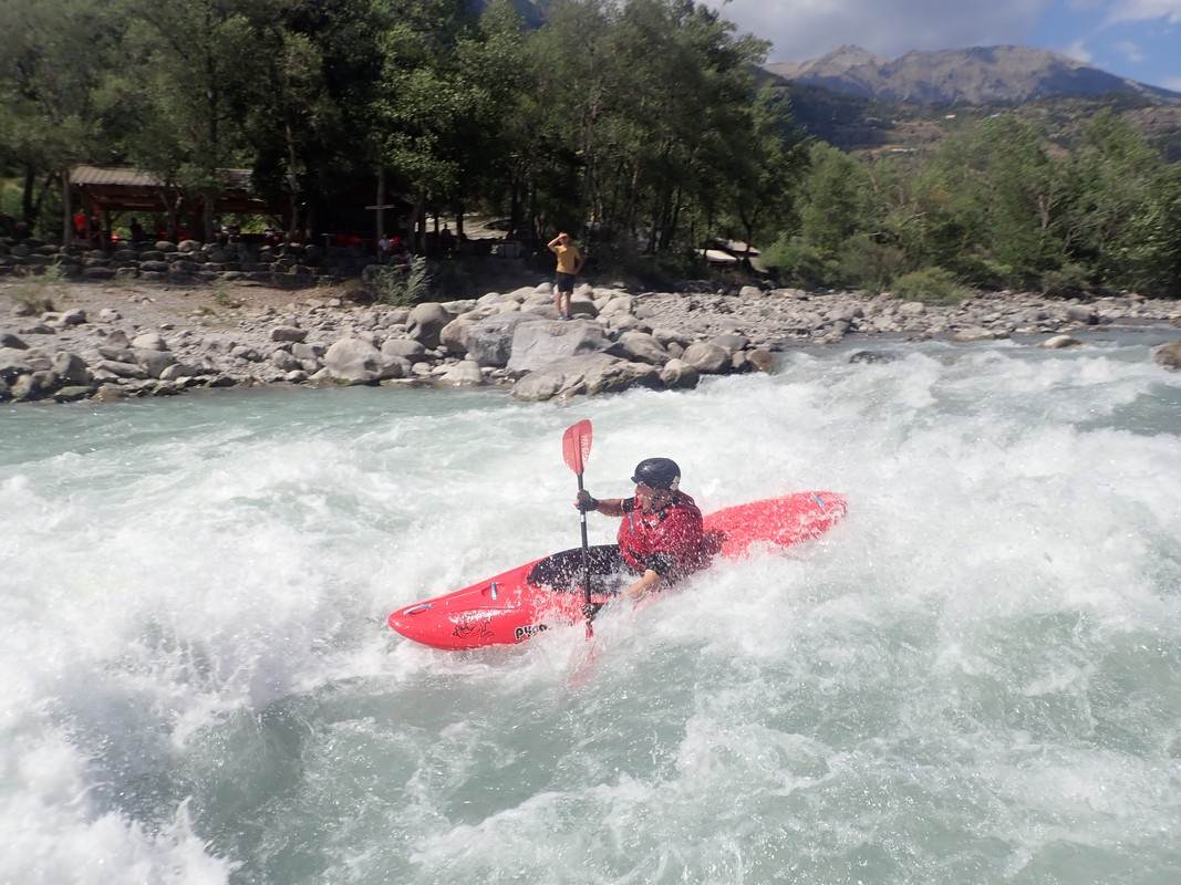 A person in a kayak in a river

Description automatically generated with low confidence
