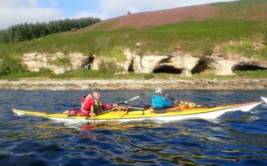 A group of people in a canoe

Description automatically generated with medium confidence