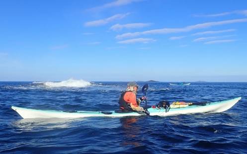 A group of people riding surfboards

Description automatically generated with low confidence