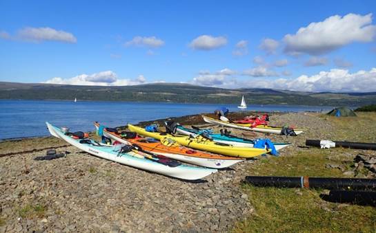 A picture containing sky, outdoor, grass, beach

Description automatically generated