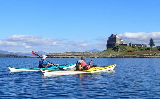 A group of people in a canoe

Description automatically generated with low confidence