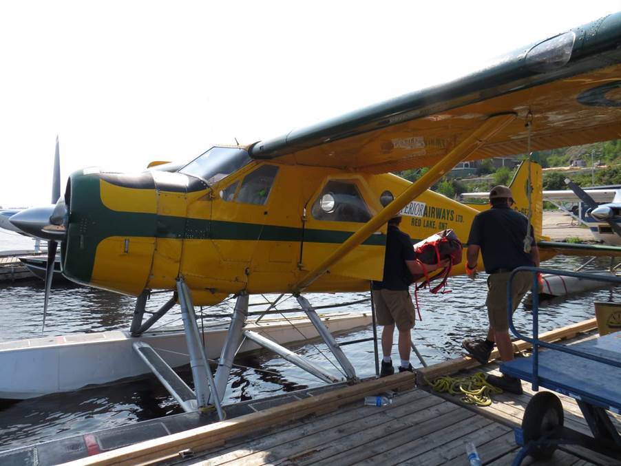 A person standing next to a plane

Description automatically generated