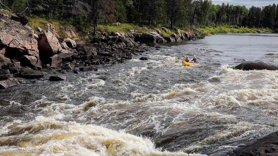 A river with rapids and rafts

Description automatically generated with medium confidence