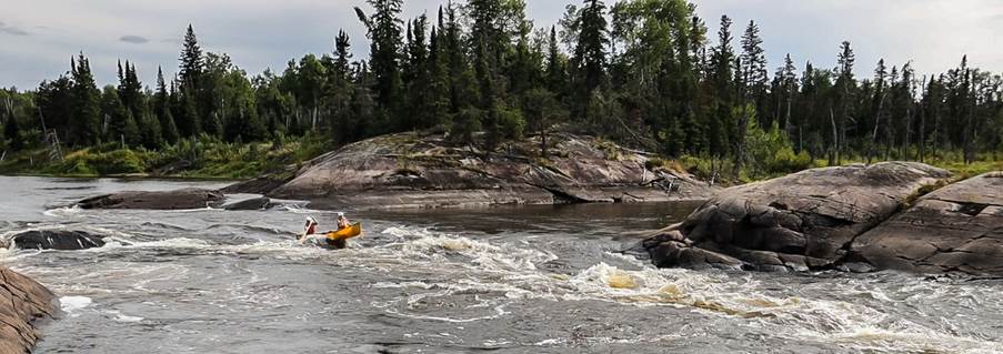 A group of people in a river

Description automatically generated