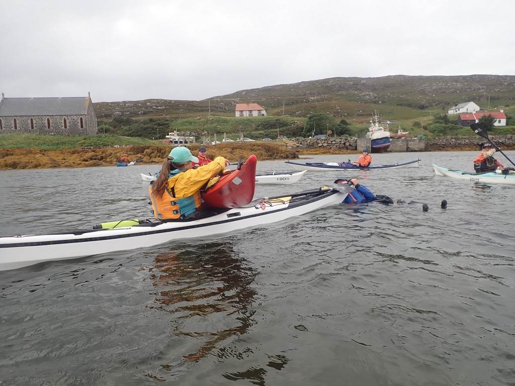 A group of people in a canoe

Description automatically generated