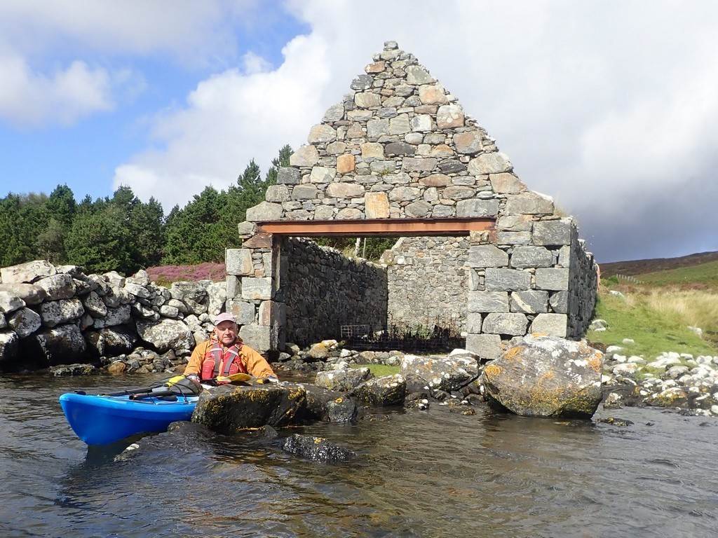 A person in a kayak in a river

Description automatically generated