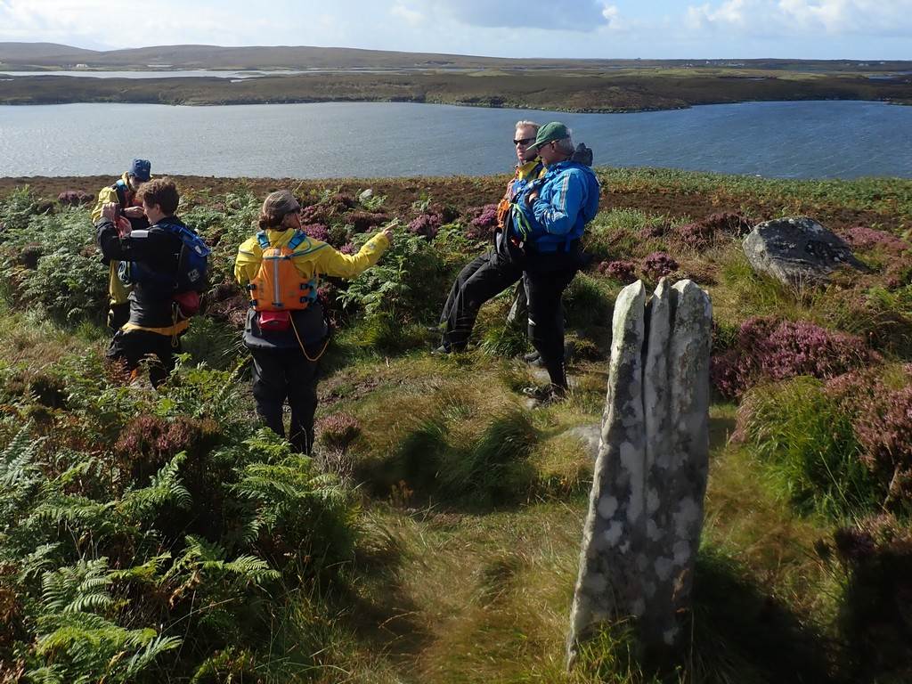 A group of people hiking on a hill

Description automatically generated