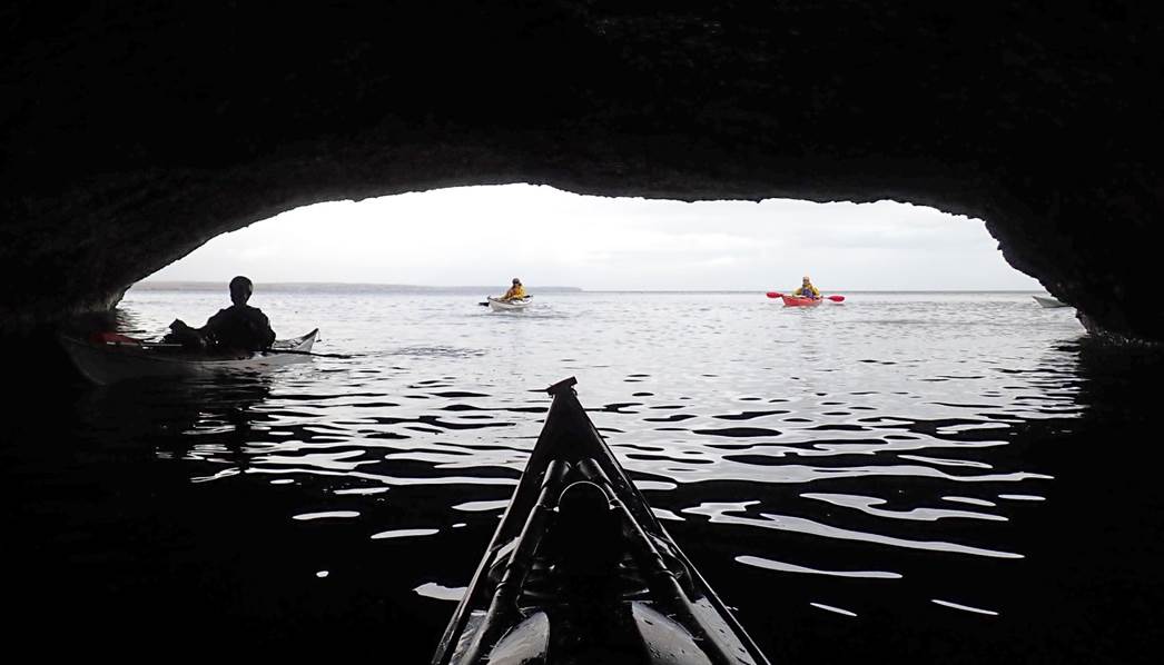 People kayaking in a cave

Description automatically generated