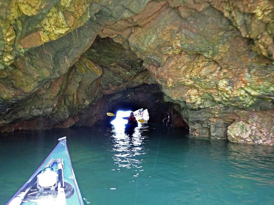 A kayak in a cave

Description automatically generated