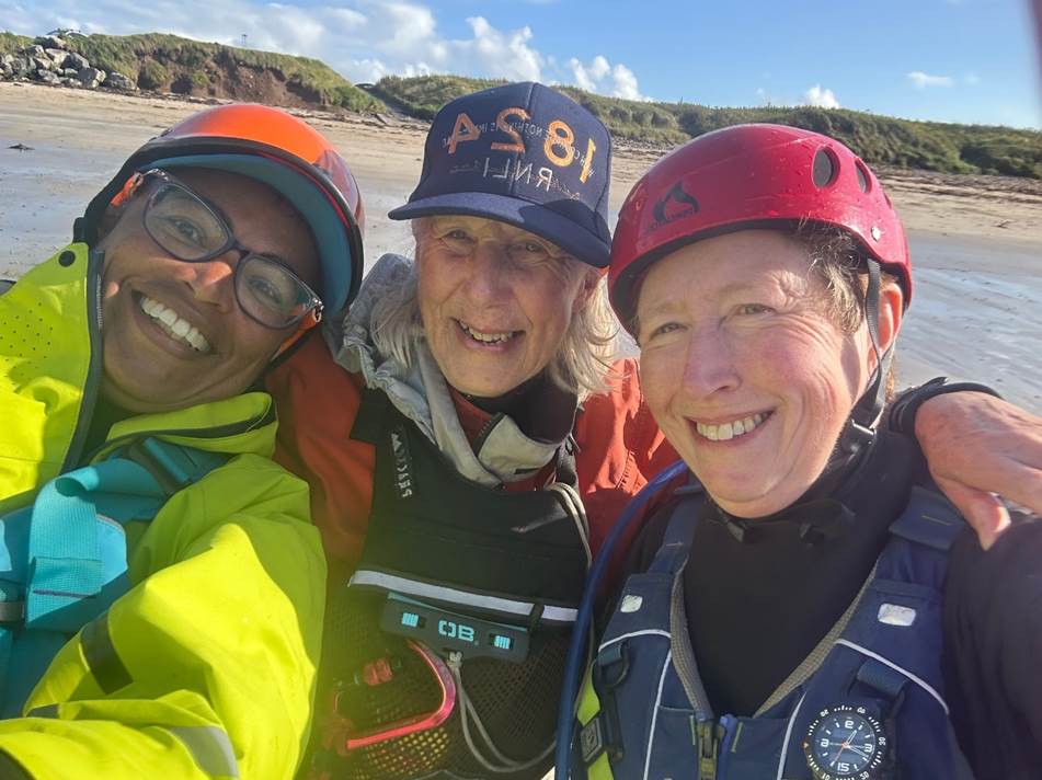 A group of people wearing helmets and standing together

Description automatically generated