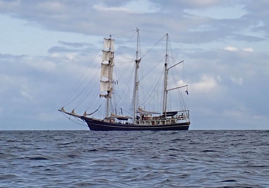A sailboat in the ocean

Description automatically generated