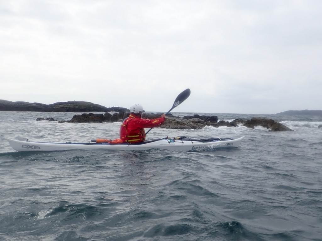 A person in a kayak on the water

Description automatically generated
