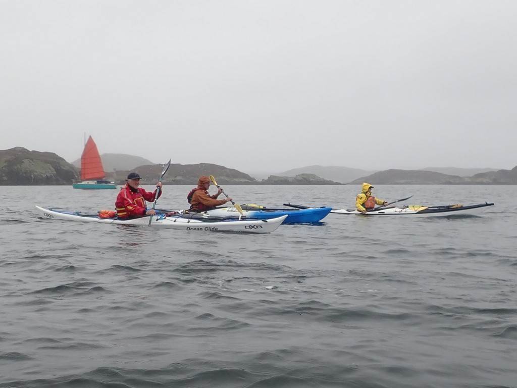 A group of people kayaking on the water

Description automatically generated