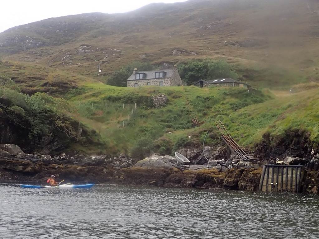 A person kayaking on a lake

Description automatically generated