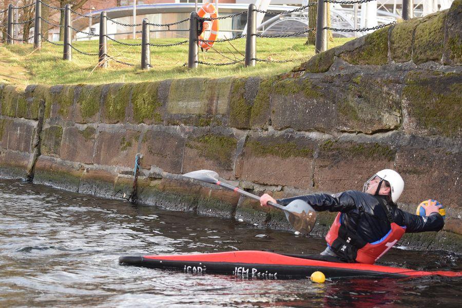 A person in a kayak in a riverDescription automatically generated with medium confidence