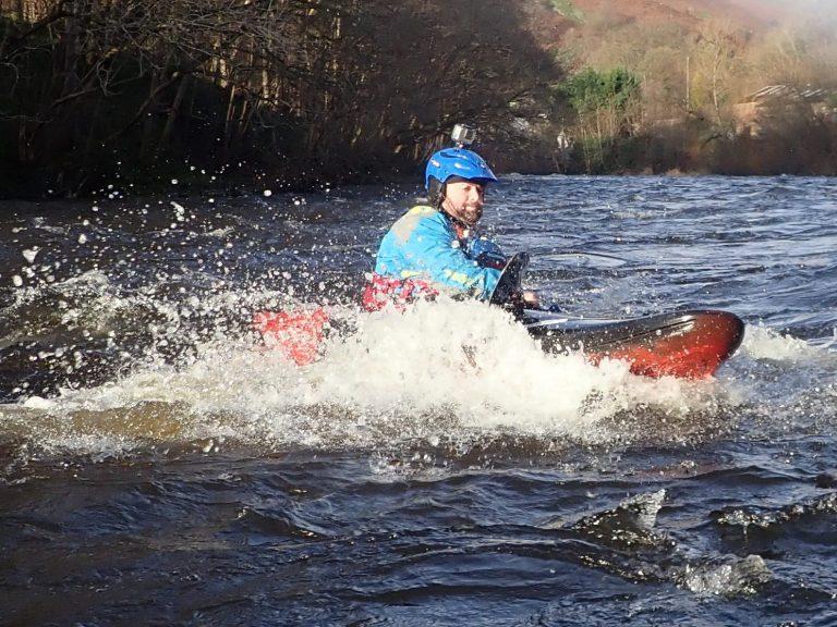A person riding a jet ski Description automatically generated with medium confidence