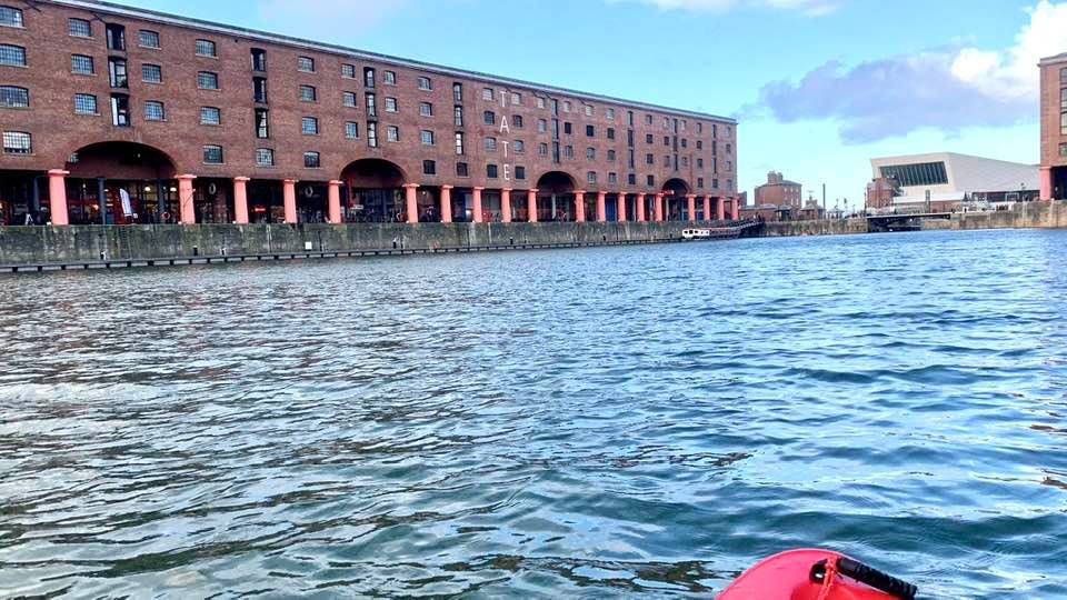 A picture containing water, outdoor, red, boatDescription automatically generated