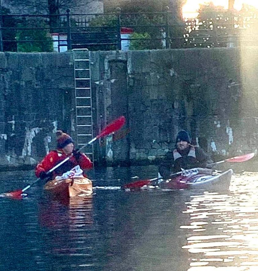 A picture containing water, sport, outdoor, rowingDescription automatically generated