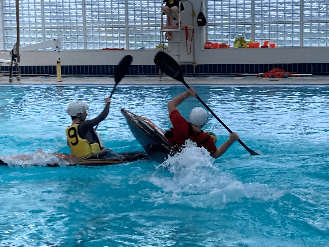 A picture containing water, sport, water sport, swimmingDescription automatically generated