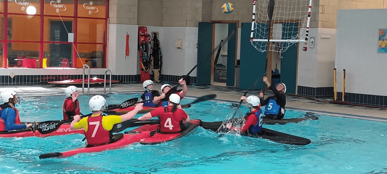 A group of people in a pool Description automatically generated with medium confidence