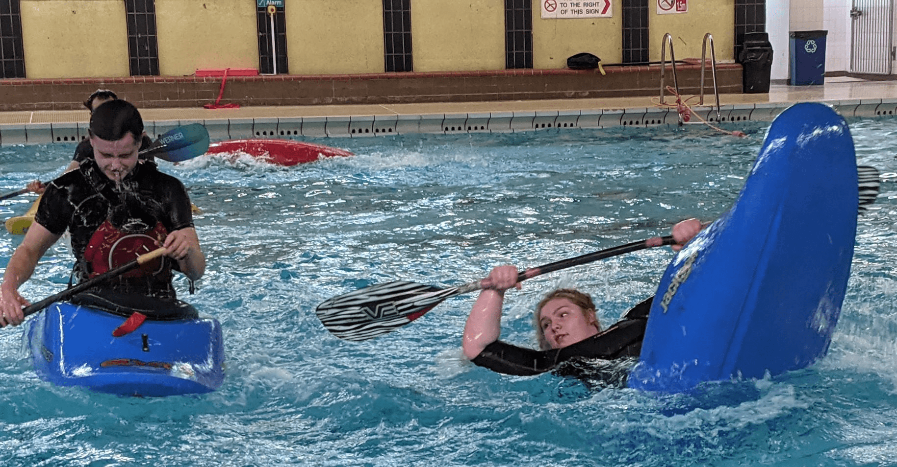 A group of people in a poolDescription automatically generated with low confidence