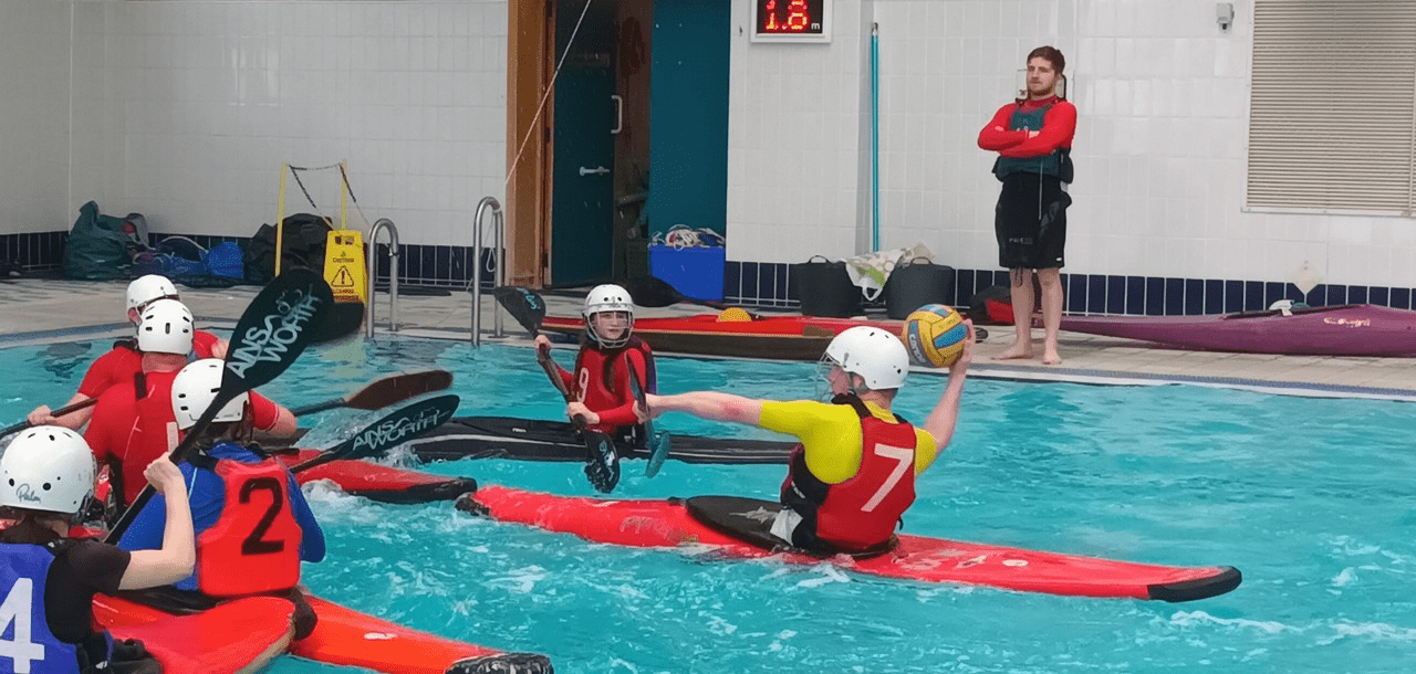 A group of people in kayaks

Description automatically generated with medium confidence