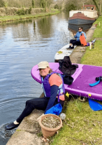 A picture containing grass, water, outdoor, person Description automatically generated