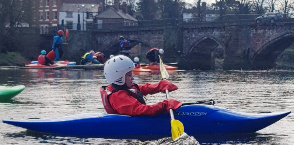 A person in a kayakDescription automatically generated with low confidence