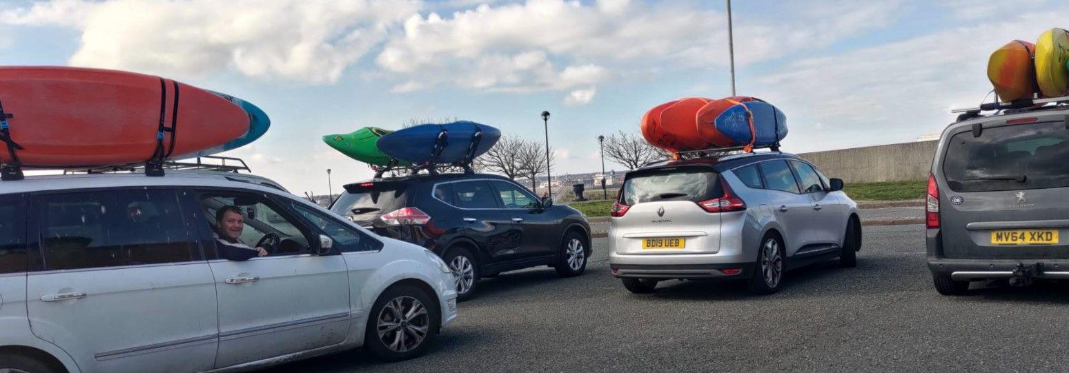 A picture containing text, car, sky, outdoorDescription automatically generated