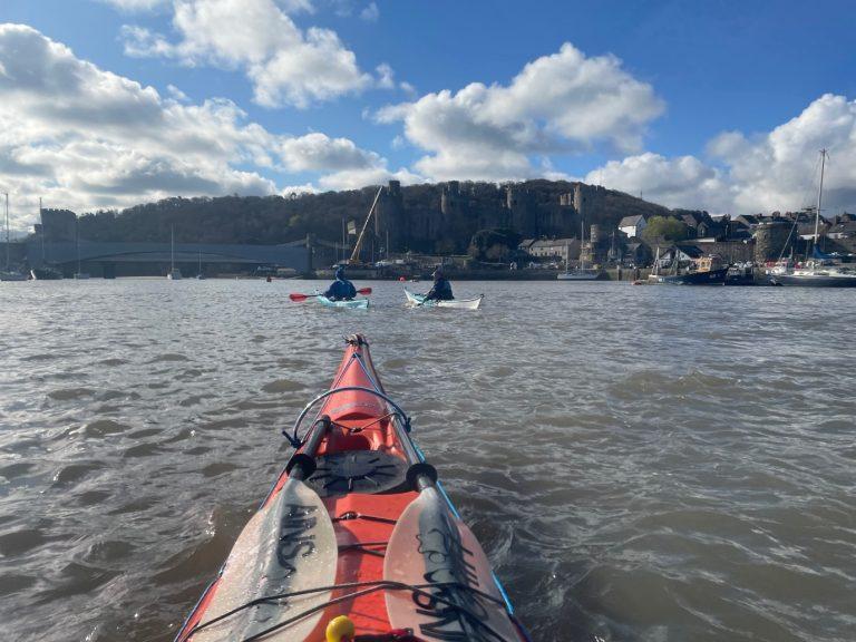 A picture containing water, sky, outdoor, boat Description automatically generated