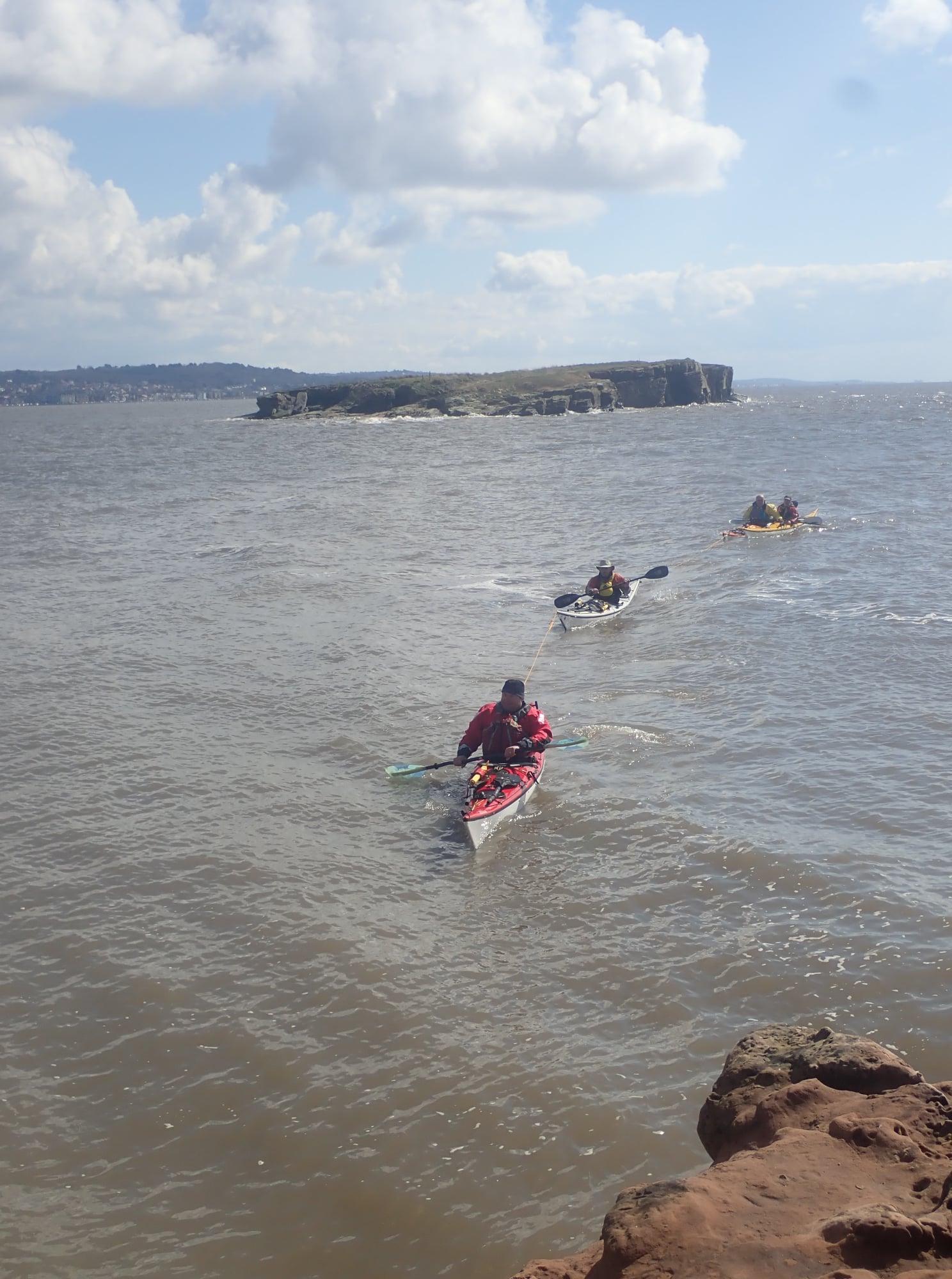 May be an image of 4 people, nature and body of water