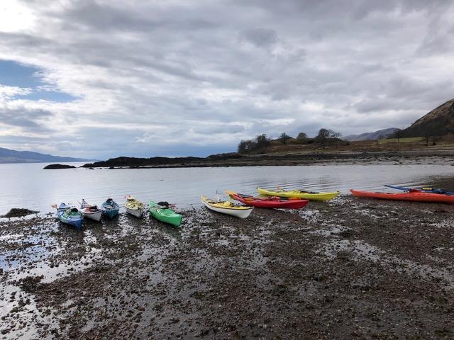 A group of boats on a beachDescription automatically generated with low confidence