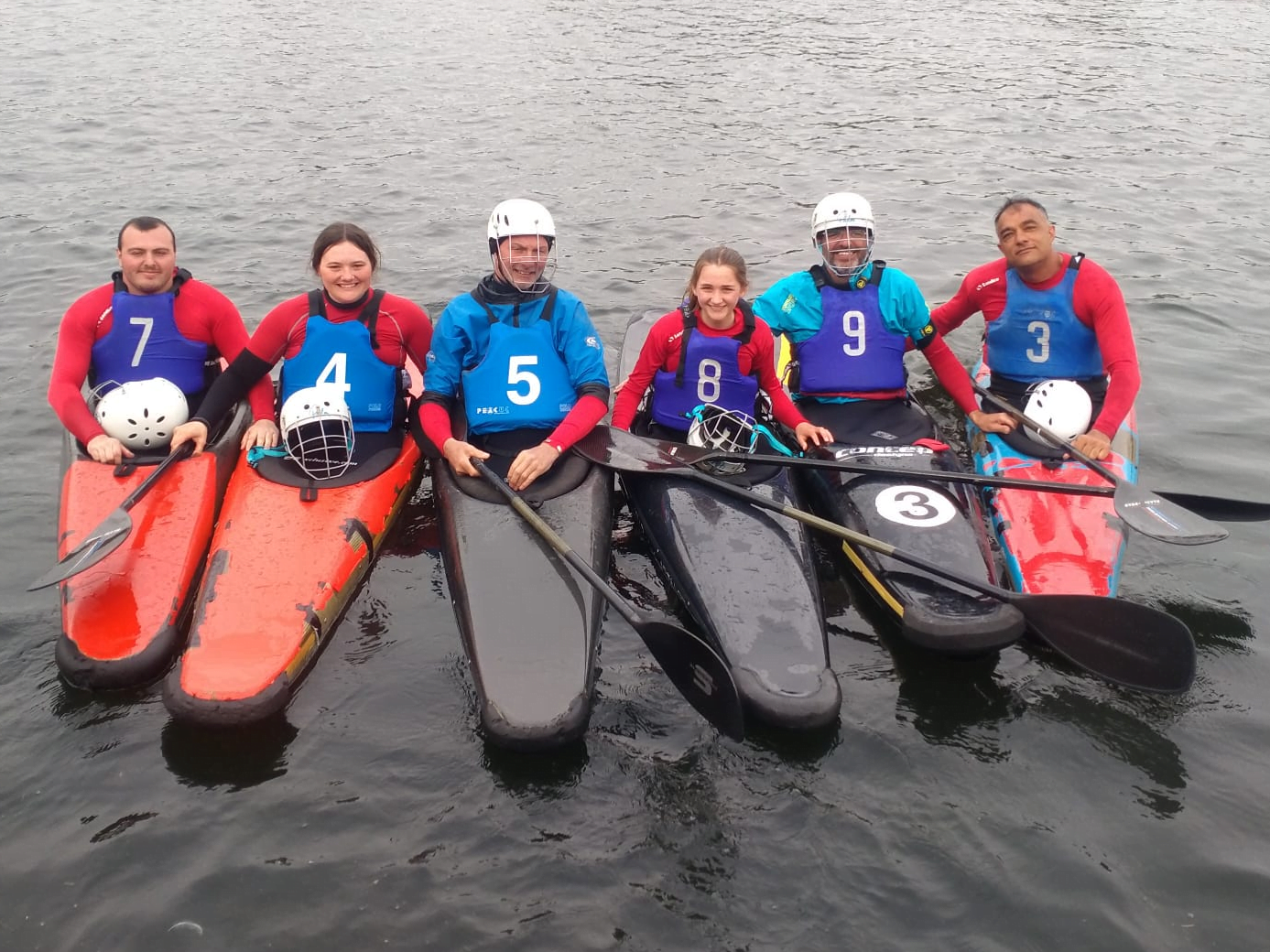 A group of people in a boatDescription automatically generated with low confidence