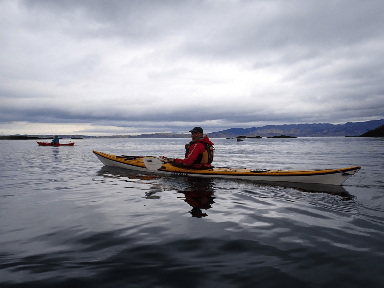 A person in a canoe Description automatically generated with low confidence