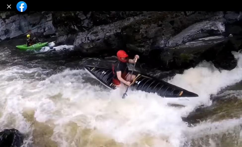 A person in a kayak in a riverDescription automatically generated with low confidence