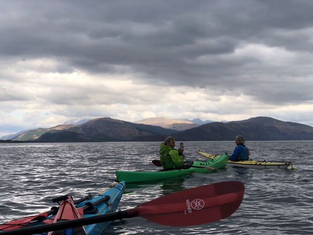 A picture containing sky, water, outdoor, boatDescription automatically generated