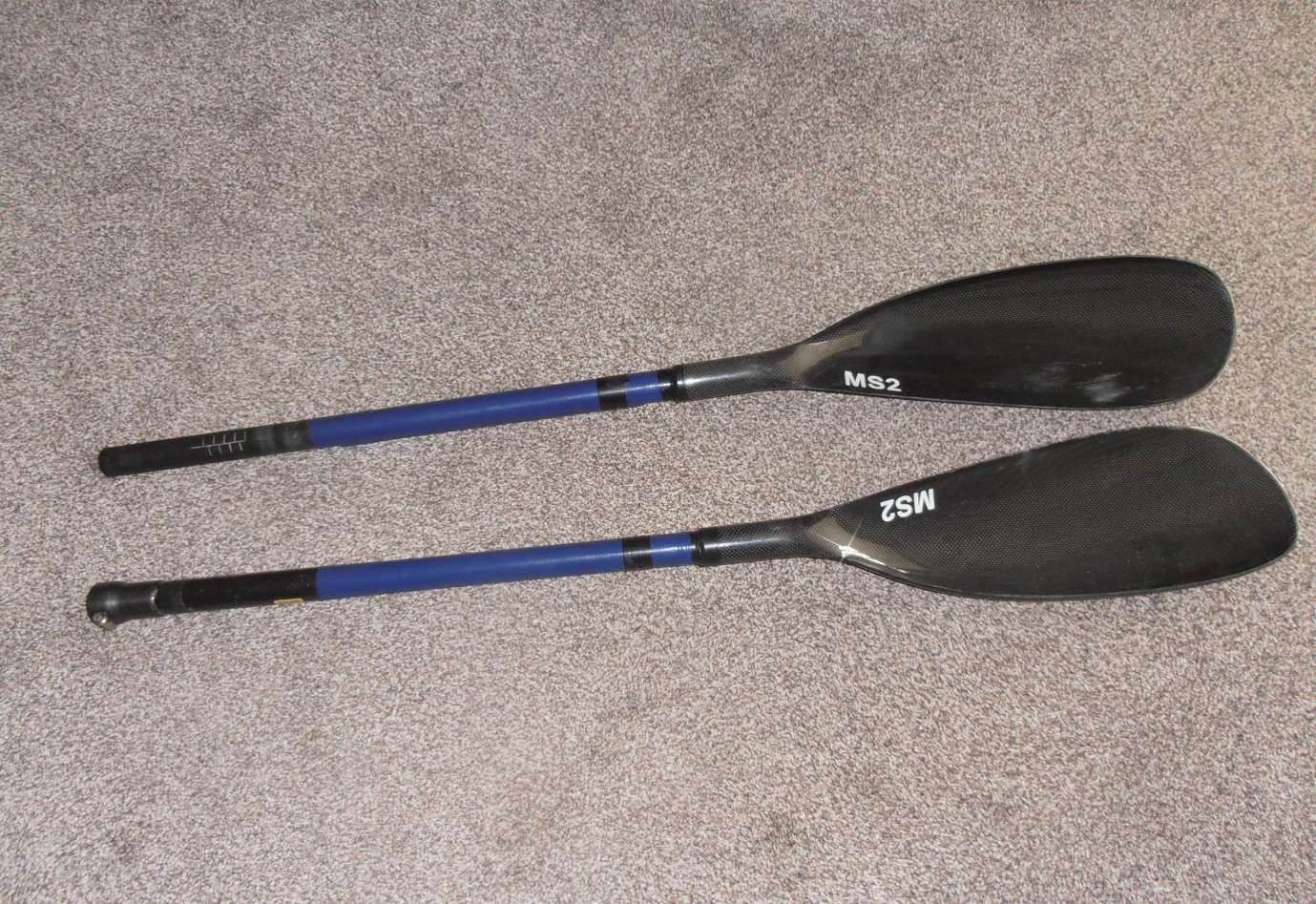 A picture containing floor, indoor, pair, layingDescription automatically generated