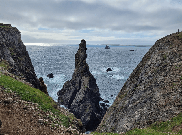 A picture containing sky, outdoor, mountain, rockDescription automatically generated