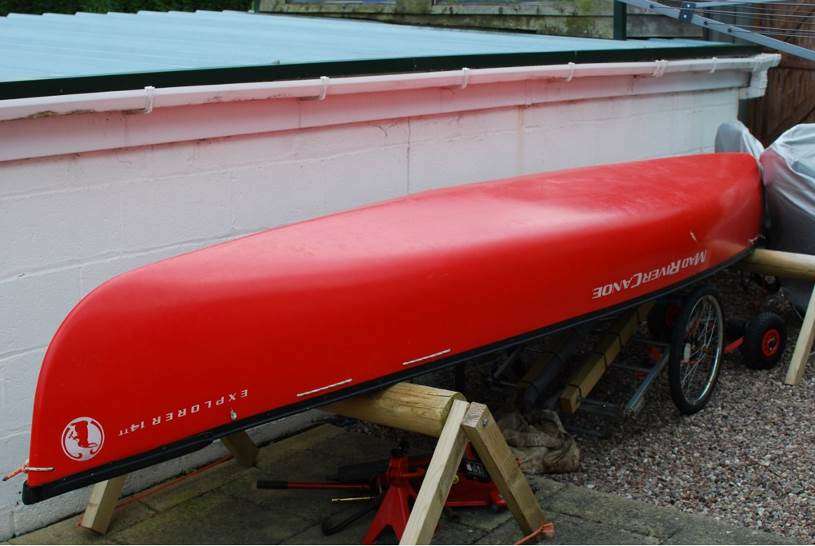 A picture containing building, outdoor, red, parkedDescription automatically generated