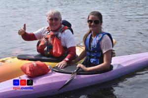 A group of people in a boat Description automatically generated with medium confidence