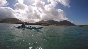 A person in a boat on the water Description automatically generated with low confidence