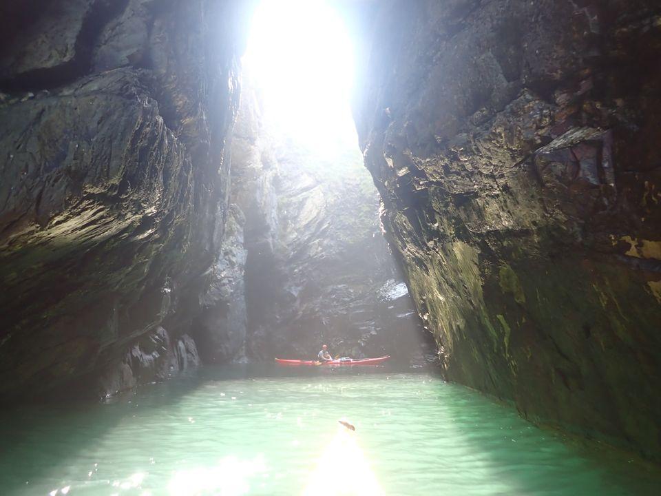 A picture containing nature, outdoor, cave, ravine

Description automatically generated